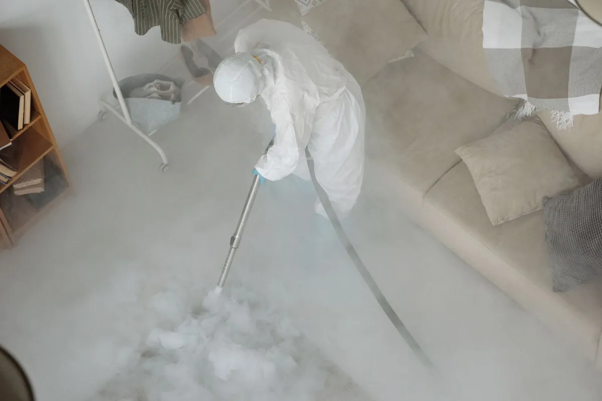 Biohazard cleanup technician in protective equipment, Erda, UT
